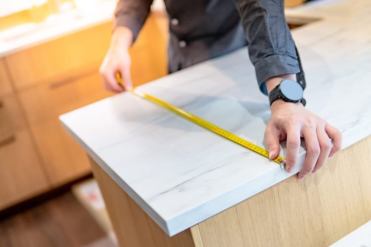 male hand designer using tape measure