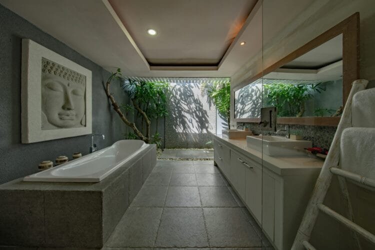 bathroom surrounded by nature and plants 