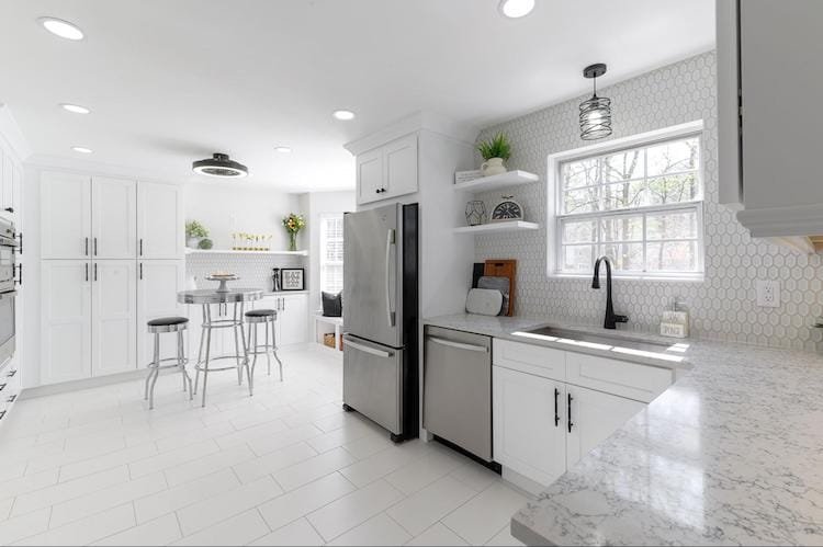 all white tile kitchen