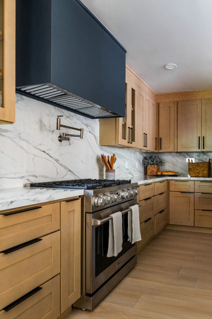 Atlanta kitchen with porcelain countertops and full-height Calacatta-look porcelain backsplash installed by Granite & Marble Solutions.