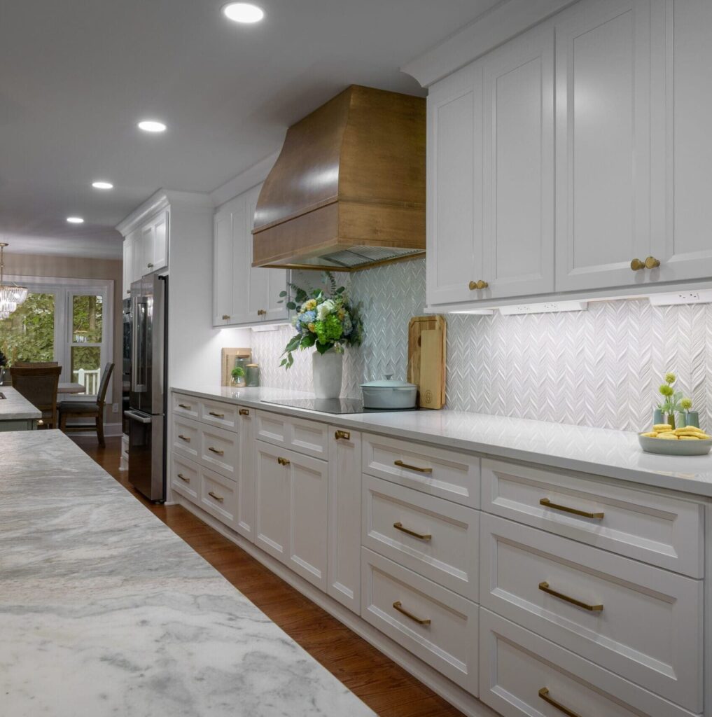 Perimeter view of Leathered Fantasy Brown Hard Marble islands with Brunello Quartz perimeter countertops in Marietta, GA kitchen.