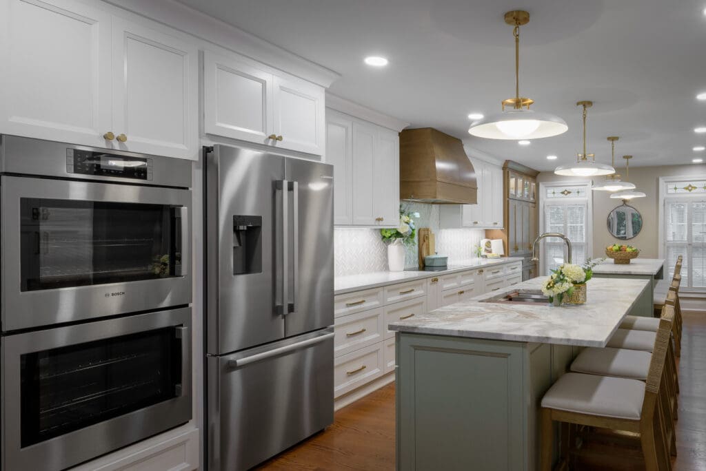 Leathered Fantasy Brown Hard Marble islands with Brunello Quartz perimeter countertops in Marietta, GA kitchen.