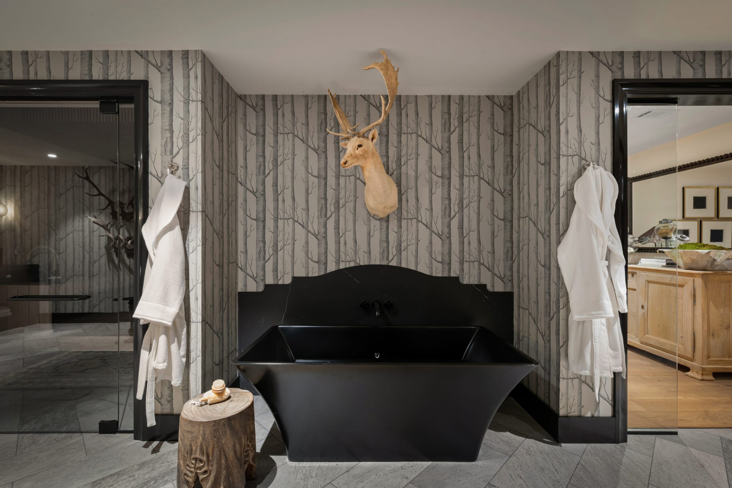 Dramatic black sculptural tub in the Wellness Center with herringbone marble floor, Southeast Designer Showhouse 2026