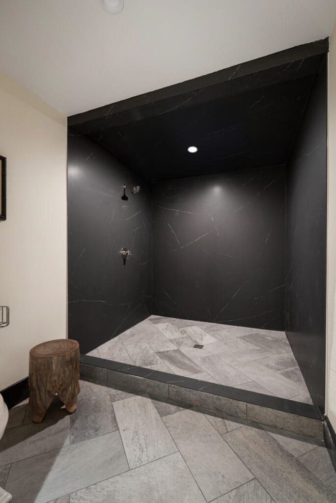 Liem Black porcelain walk-in shower interior in the Wellness Center, Southeast Designer Showhouse 2026