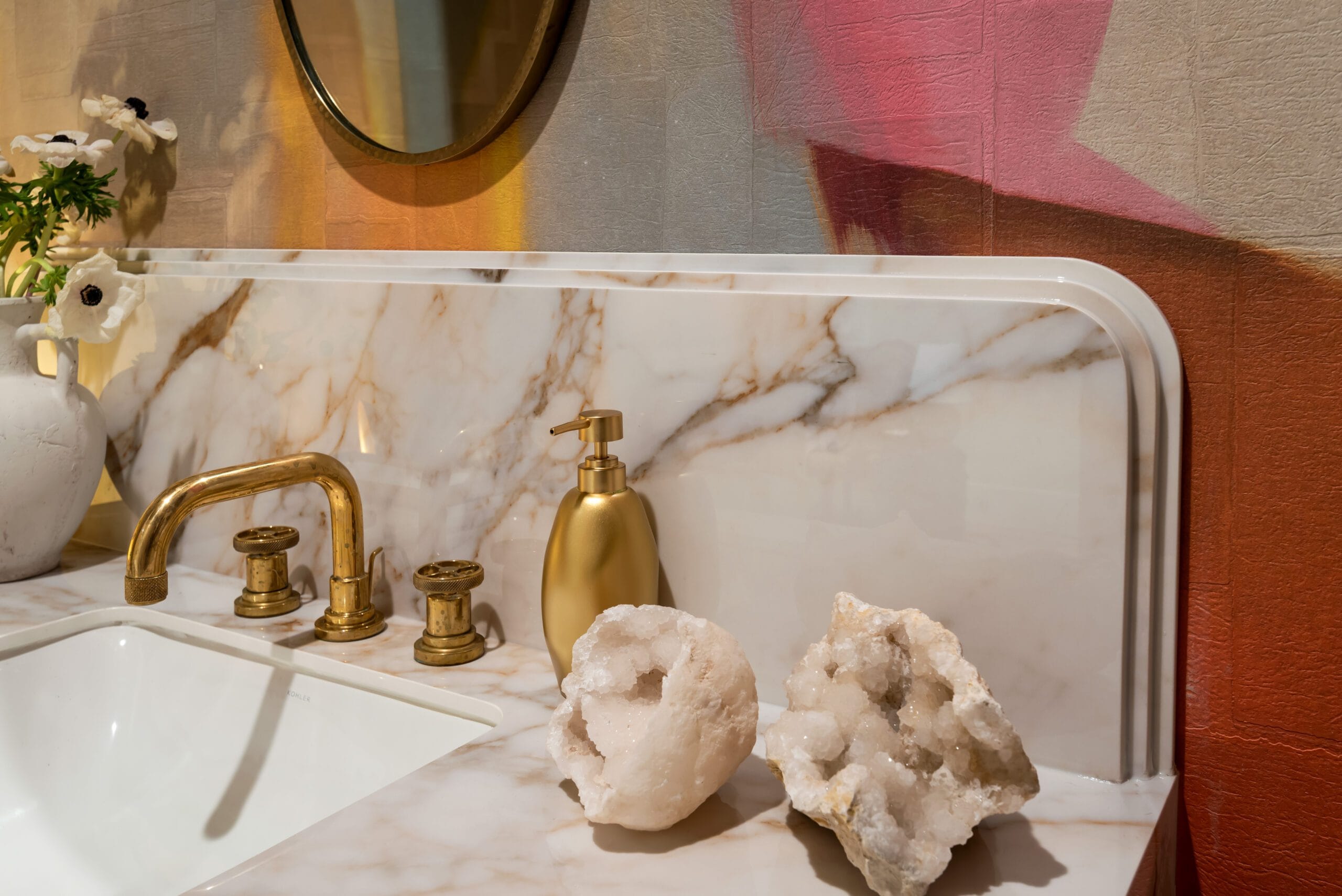 Calacatta Antico porcelain countertop detail with brass faucet and crystal geode, Art Deco Powder Room, Southeast Designer Showhouse 2026