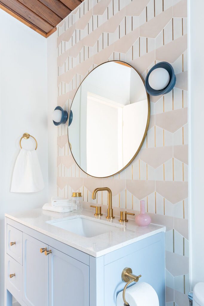 Honed Rhino White secondary bath — mirror and sconce, Doraville GA | GMS
