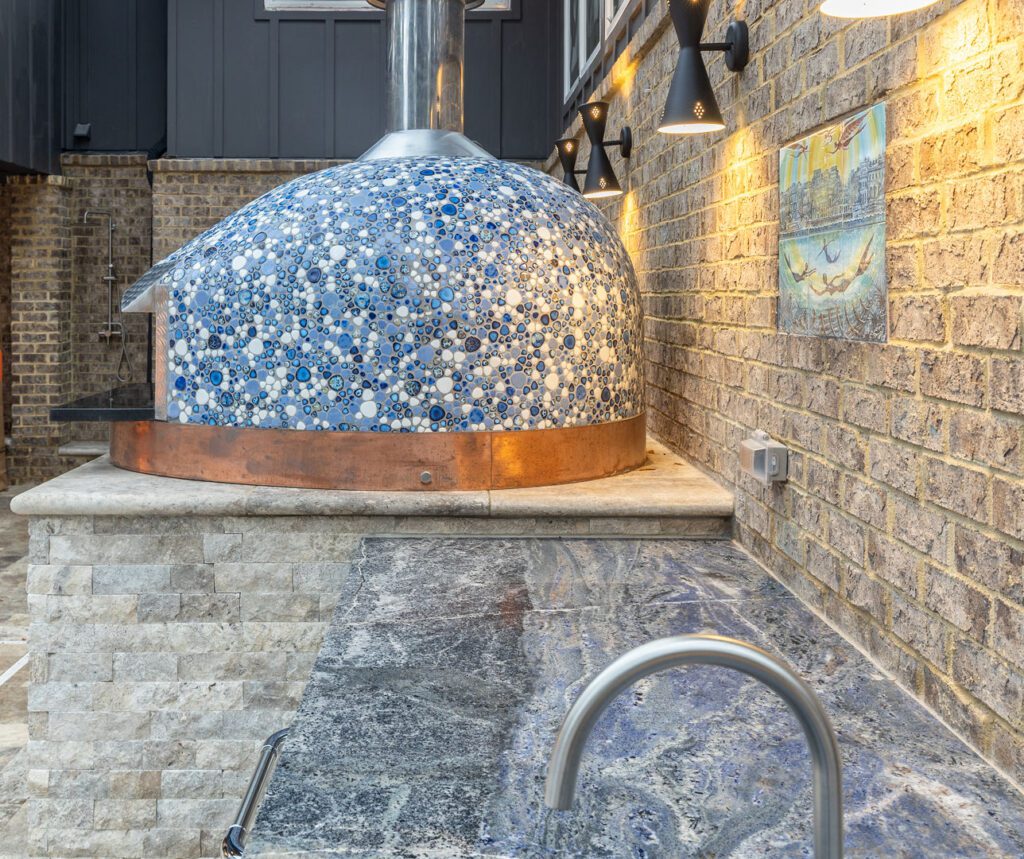 Victoria Blue Granite outdoor pizza kitchen — copper wood-fired pizza oven, Doraville GA | GMS